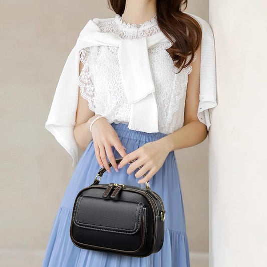 Moteartikler - Elegant dobbelt lags crossbody veske med bred stropp