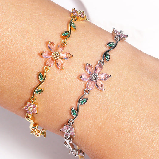 Kvinnearmbånd med kirsebærblomst og rhinestones