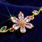Kvinnearmbånd med kirsebærblomst og rhinestones
